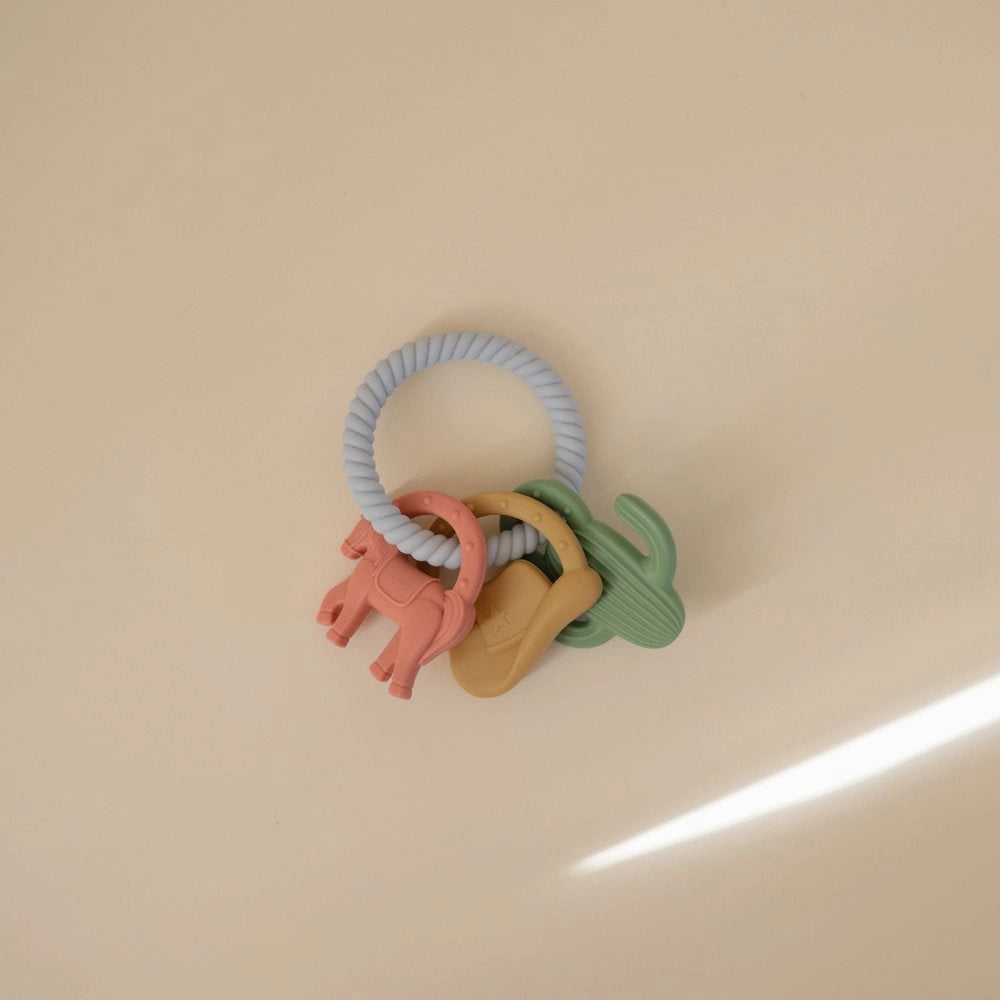 Mushie bidering Western med cowboy-inspirerede figurer – blød bidering i silikone til baby og tandfrembrud